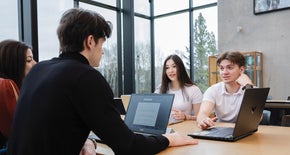 students working on a project for Business Fundamentals course